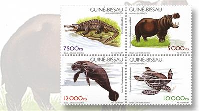 guinea-bissau-se-tenant-block-of-fou-endangered-animals-stamps